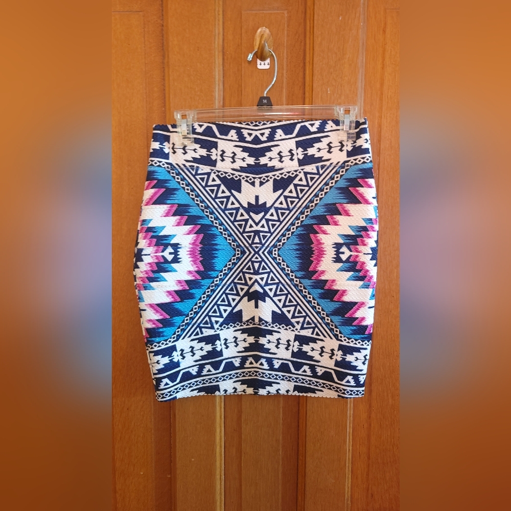 Stretchy mini dress with indigenous patterns for the bold, long legs,and heels.